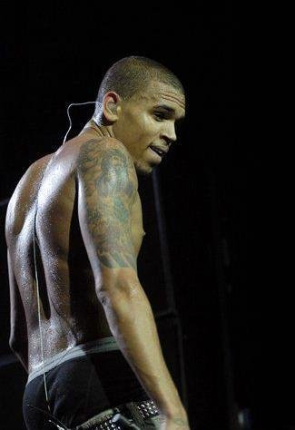Chris Brown takes his shirt off