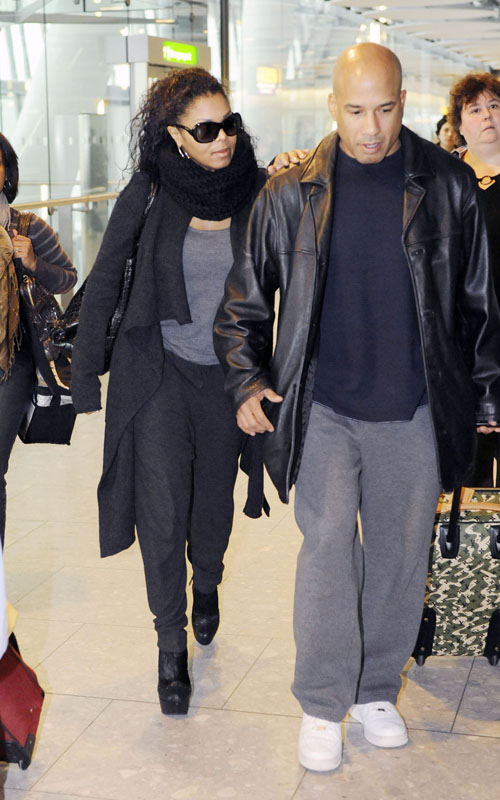 Janet Jackson and her bodyguard were spotted landing in Heathrow airport 